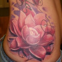 Great pink lotus flower tattoo on ribs