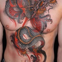 Great red dragon tattoo on chest and abdomen