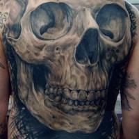 Large human skull tattoo on the back