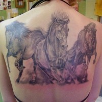 Great wonderful three galloping horses tattoo on back