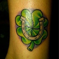 Green clover with a horseshoe tattoo