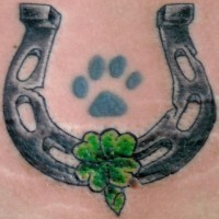 Green clover with paw and horseshoe tattoo