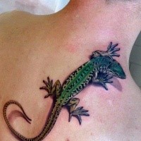 Green naturally colored lizard sitting on upper back 3D realistic tattoo