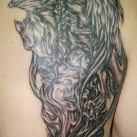 Griffin tattoo on back shoulder
