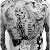 Grim reaper with a scythe in japanese style tattoo on back