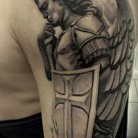 Guardian angel with shield tattoo on shoulder