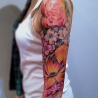 Half 3D style colored beautiful looking half sleeve tattoo of various jungle flowers