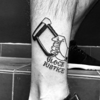 Hand with old style lock black and white tattoo on ankle with lettering