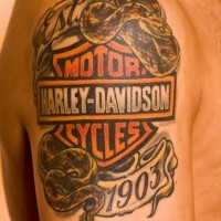 Harley davidson logo with snake tattoo on shoulder