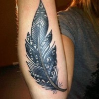 Harsh black tribal  feather tattoo on arm