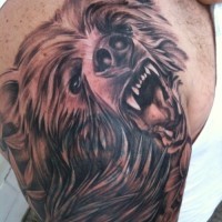 Head snarling bear tattoo on shoulder