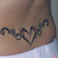 Heart and flowers tattoo on lower back