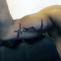 Heart rhythm black ink tattoo on biceps