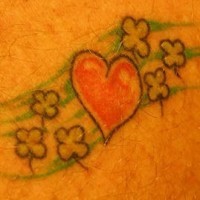 Heart symbol and shamrocks tattoo