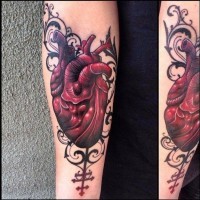 Heart with ornament forearm tattoo by Jacob Wiman