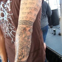 Hebrew lettering, black armband and giant roped anchor in water waves pale sleeve tattoo