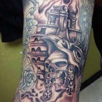 Homemade black ink tribal skull tattoo on arm combined with big temple