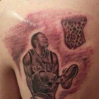 Homemade carelessly painted shoulder tattoo of basketball player