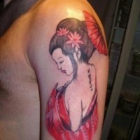Homemade colored funny seductive geisha tattoo on shoulder with lettering and flowers
