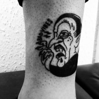 Homemade like black and white funny Dracula with lettering tattoo on ankle