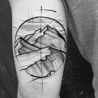 Homemade like black ink circle shaped mountains tattoo on arm