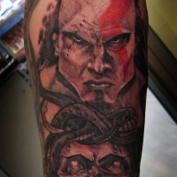 Homemade like colored big barbarian portrait tattoo on forearm with Medusa head
