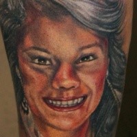 Homemade like colored illustrative style arm tattoo of smiling woman