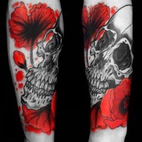 Homemade like colored simple flowers with skull tattoo on arm
