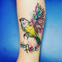 Homemade like watercolor like bird tattoo on leg with lettering