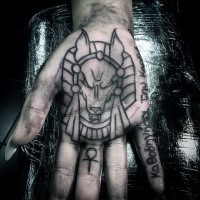Homemade style black ink hand tattoo of Egypt God with lettering