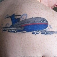 Homemade style colored scapular tattoo of big passenger plane