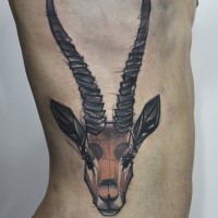 Homemade style colored side tattoo of big goat head with horns