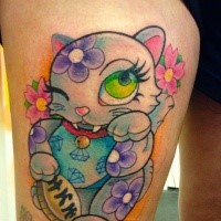 Homemade style colored thigh tattoo of maneki neko japanese lucky cat with flowers and lettering