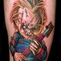 Horror movie colored evil maniac doll tattoo on thigh