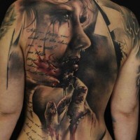 Horror movie like bloody woman portrait tattoo on back with lettering