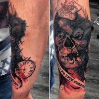 Horror movie like colored monster face tattoo on forearm with lettering