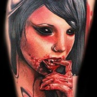 Horror movie like realistic colored bloody vampire woman tattoo on shoulder