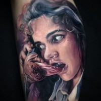 Horror movie like very detailed colored tattoo on scared girl