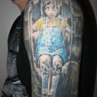Horror movie themed colored frozen girl tattoo on upper arm
