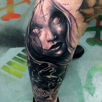 Horror style black ink leg tattoo of mystical woman portrait