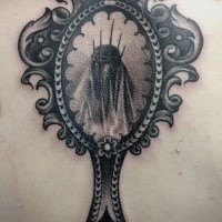 Horror style colored back tattoo of mirror with creepy woman in it