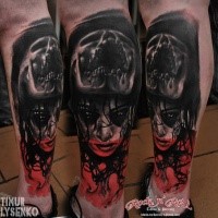 Horror style colored leg tattoo of demonic woman with screaming skull
