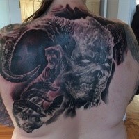 Horror style colored upper back tattoo of devil face