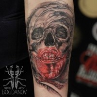 Horror style creepy looking forearm tattoo of bloody monster face
