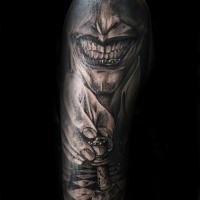 Horror style detailed arm tattoo of creepy man with chess board figure