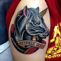 Horseshoe and unicorn portrait colored shoulder tattoo with funny banner lettering in old school style