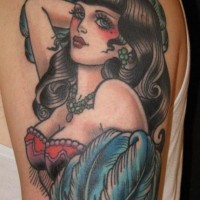 Hot and sexy brunette pin up girl colored shoulder tattoo with blue feather