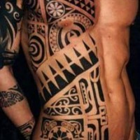 Huge black and white Polynesian ornaments tattoo on half of the body