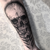 Human skull and skeleton tattoo on forearm in engraving style