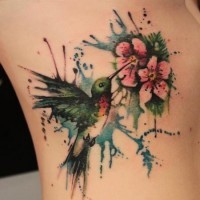 Paint splash hummingbird tattoo